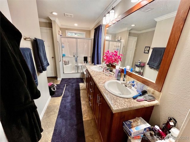 bathroom with crown molding, a shower with door, and vanity