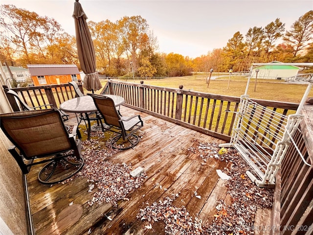 deck at dusk with a yard