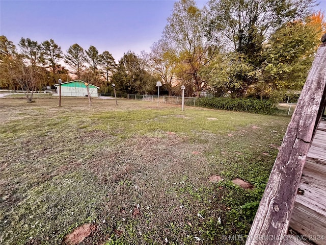 view of yard at dusk