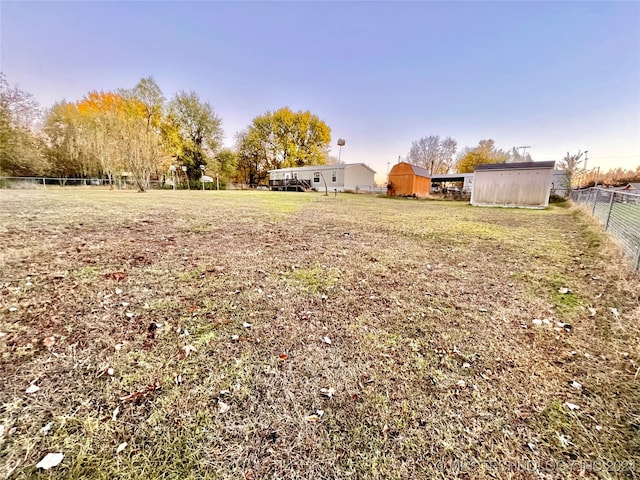 view of yard with a storage unit