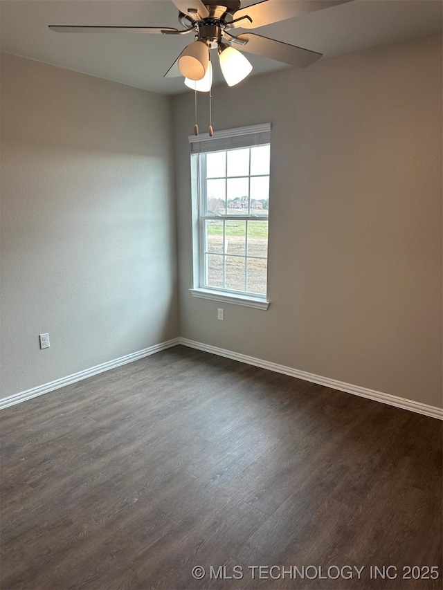 unfurnished room featuring ceiling fan and dark hardwood / wood-style flooring