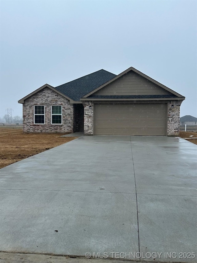 ranch-style home featuring a garage