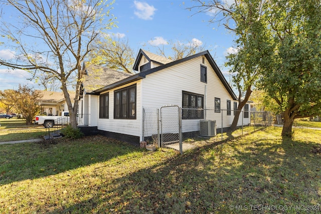 view of home's exterior featuring a yard and central air condition unit