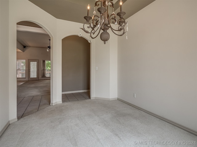 unfurnished room featuring light carpet, vaulted ceiling with beams, and ceiling fan with notable chandelier