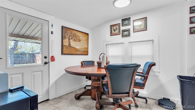 dining area with light tile patterned floors