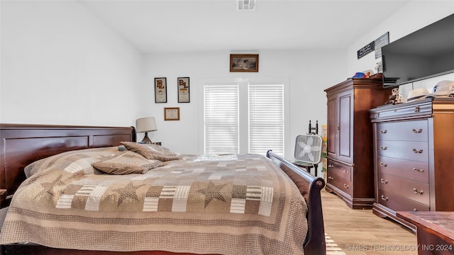 bedroom with light hardwood / wood-style flooring