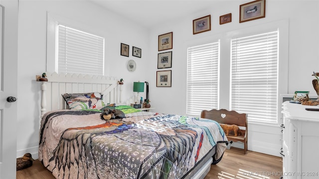 bedroom with light wood-type flooring