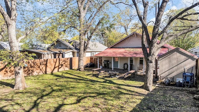 back of property with a lawn