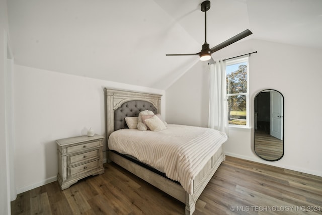 bedroom with hardwood / wood-style flooring, ceiling fan, and lofted ceiling