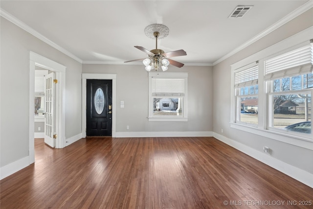 entrance foyer featuring ceiling fan, ornamental molding, and dark hardwood / wood-style flooring