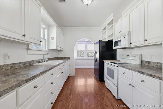 kitchen featuring ornamental molding, sink, white cabinets, and white appliances