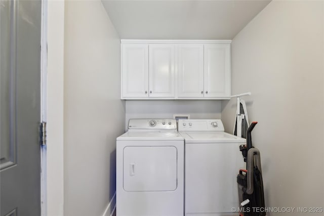 laundry area with cabinets and washer and dryer