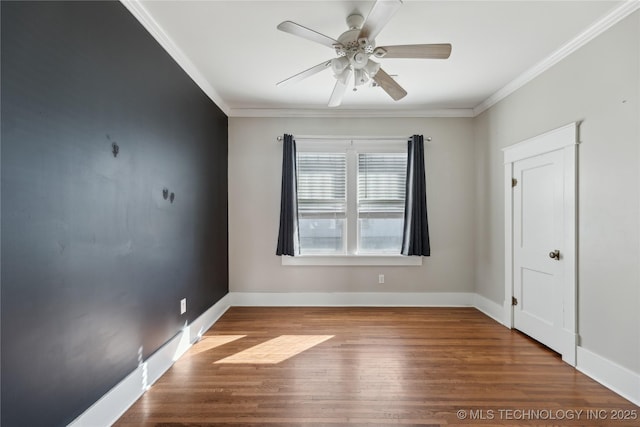 spare room featuring ceiling fan, hardwood / wood-style flooring, and ornamental molding