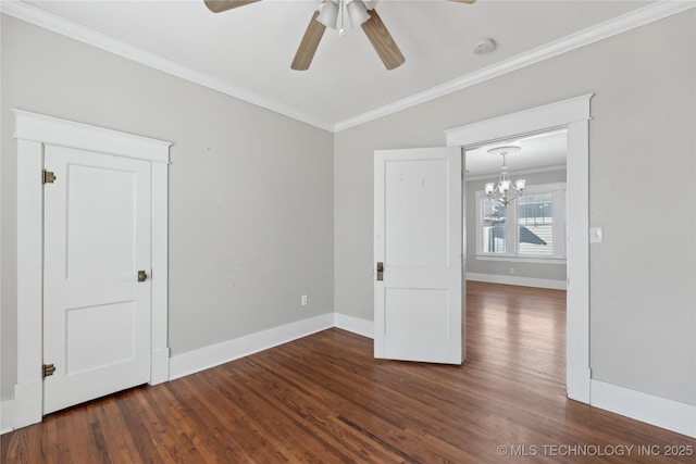 unfurnished room featuring ceiling fan with notable chandelier, dark hardwood / wood-style floors, and crown molding