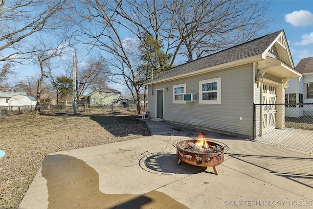 exterior space with a patio and a fire pit