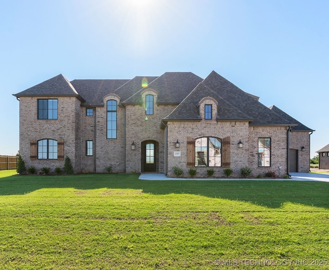 17537 S 56th E Ave, Bixby, OK 74008 - french country inspired facade featuring brick siding, a front yard, and a shingled roof