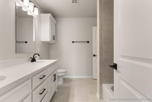 17537 S 56th E Ave, Bixby, OK 74008 - full bathroom featuring double vanity, baseboards, toilet, and tile patterned floors