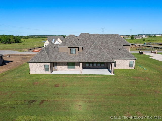 17537 S 56th E Ave, Bixby, OK 74008 - view of front of house with a patio area, a front lawn, and a shingled roof
