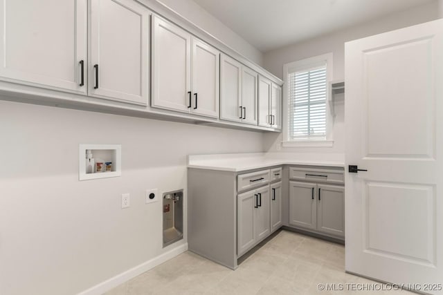 17537 S 56th E Ave, Bixby, OK 74008 - washroom with cabinet space, hookup for an electric dryer, washer hookup, light tile patterned flooring, and baseboards
