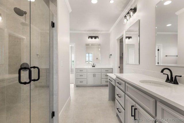 17537 S 56th E Ave, Bixby, OK 74008 - full bath with two vanities, a shower stall, crown molding, recessed lighting, and tile patterned flooring