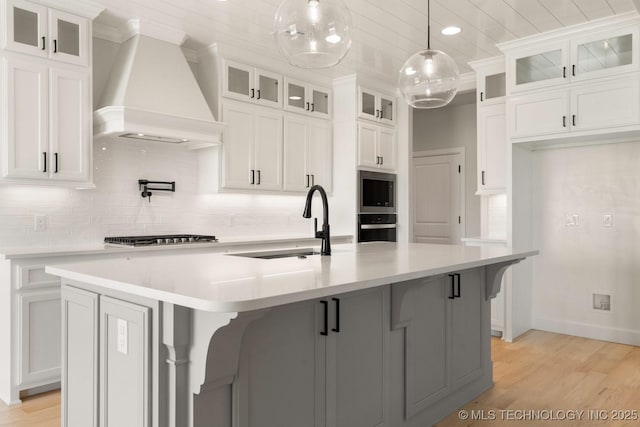 17537 S 56th E Ave, Bixby, OK 74008 - kitchen with premium range hood, stainless steel appliances, decorative backsplash, white cabinets, and ornamental molding