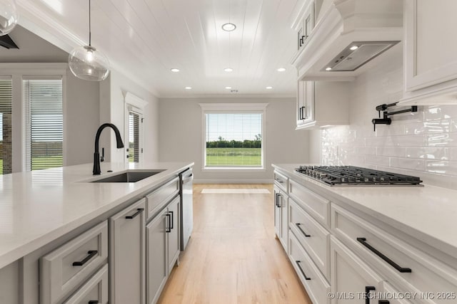 17537 S 56th E Ave, Bixby, OK 74008 - kitchen featuring ventilation hood, a sink, stainless steel appliances, light wood-style floors, and recessed lighting