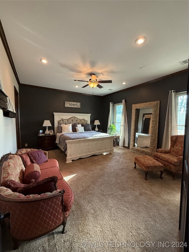 bedroom with carpet flooring, multiple windows, ceiling fan, and crown molding