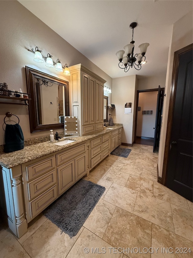 bathroom featuring vanity and a notable chandelier