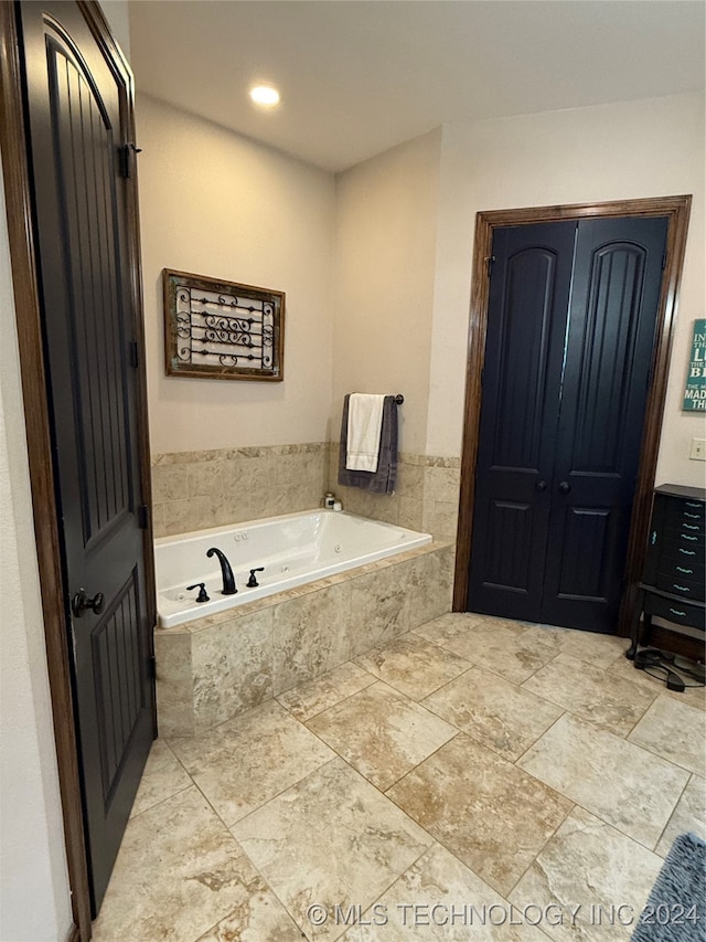 bathroom featuring tiled tub