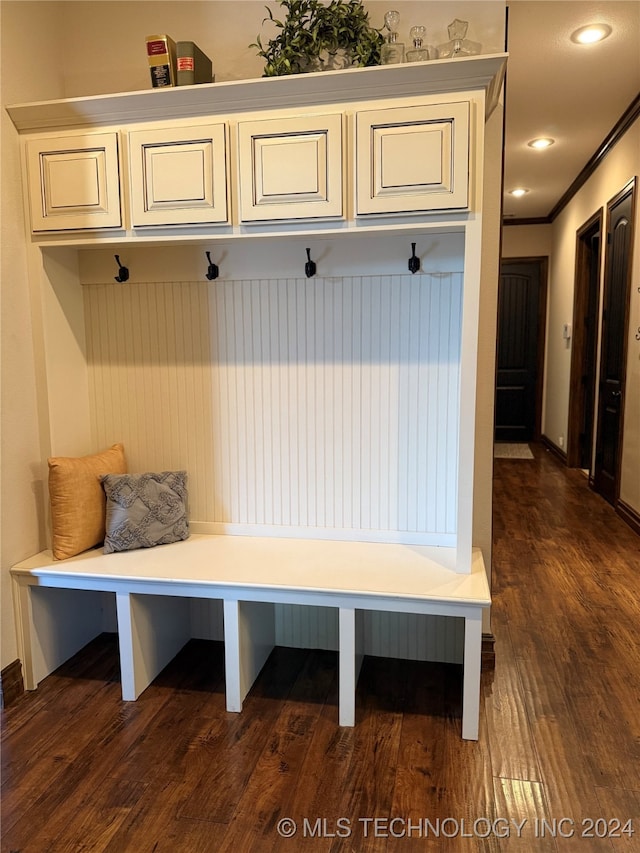 mudroom featuring dark hardwood / wood-style floors and ornamental molding