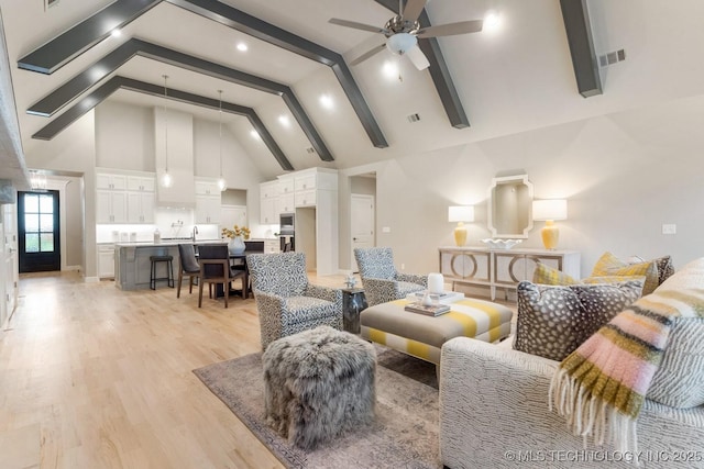2708 W Van Buren Ct, Broken Arrow, OK 74134 - living area with high vaulted ceiling, a ceiling fan, beamed ceiling, and light wood-style flooring