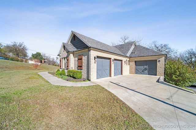 view of side of home featuring a lawn and a garage