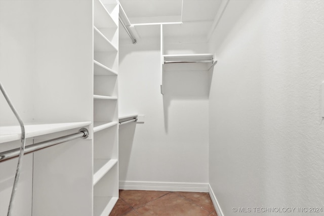 walk in closet featuring tile patterned floors