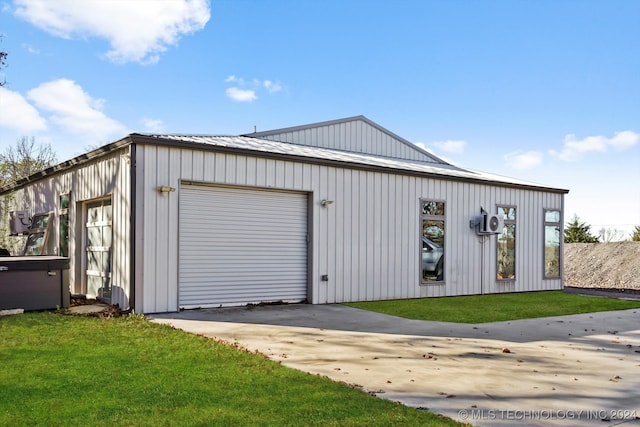 garage featuring a lawn