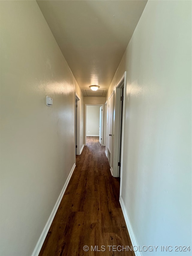 corridor featuring dark hardwood / wood-style floors