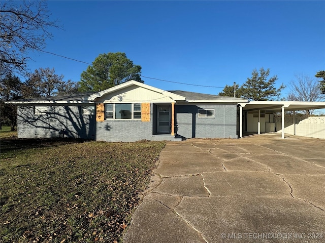 ranch-style home with a carport