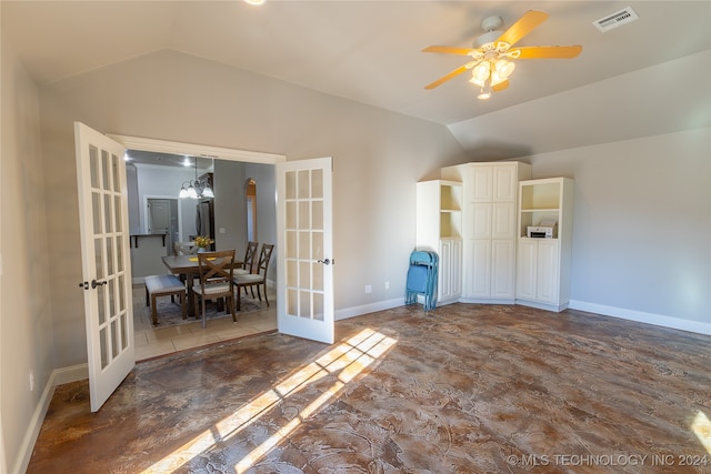 interior space with ceiling fan with notable chandelier, lofted ceiling, and french doors