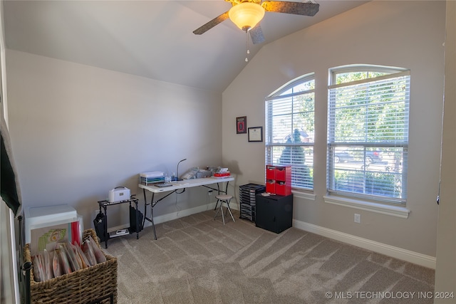 office area featuring ceiling fan, light colored carpet, and vaulted ceiling