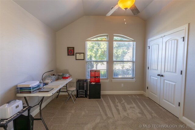 office featuring light carpet, ceiling fan, and lofted ceiling