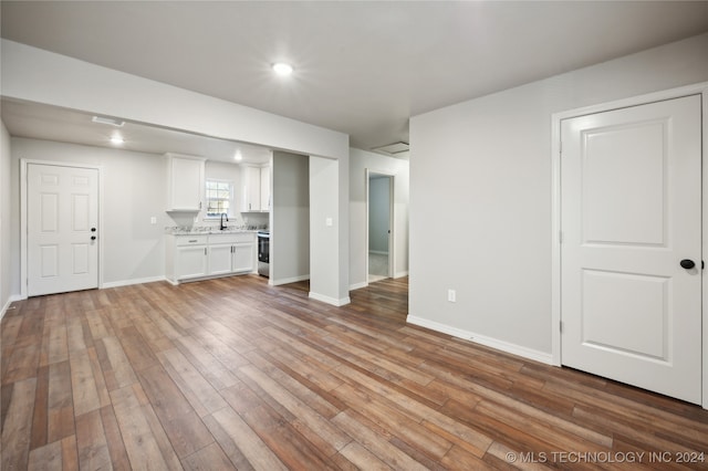 unfurnished living room with light wood-type flooring