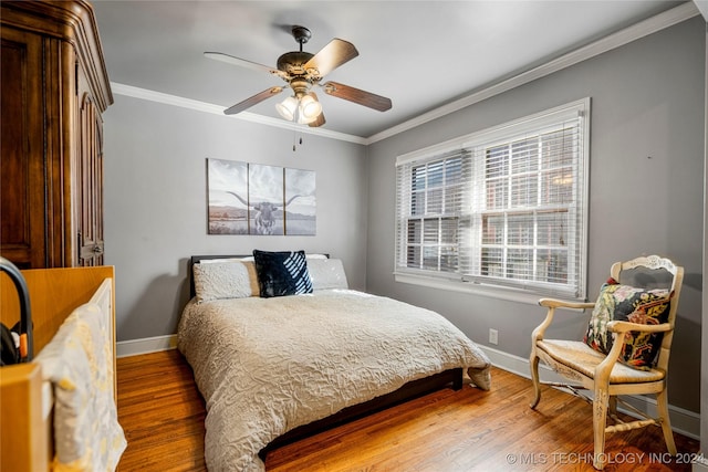 bedroom featuring ceiling fan, hardwood / wood-style flooring, and ornamental molding