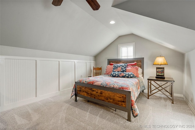 bedroom featuring ceiling fan, light carpet, and vaulted ceiling