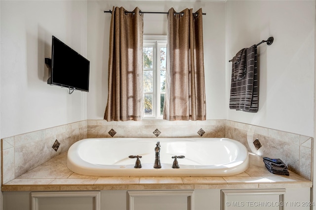 bathroom featuring a tub to relax in