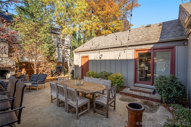 view of patio / terrace featuring an outdoor stone fireplace