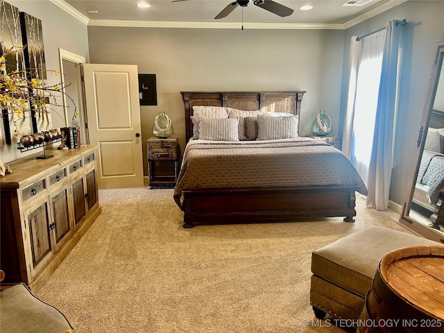 carpeted bedroom featuring ceiling fan and ornamental molding