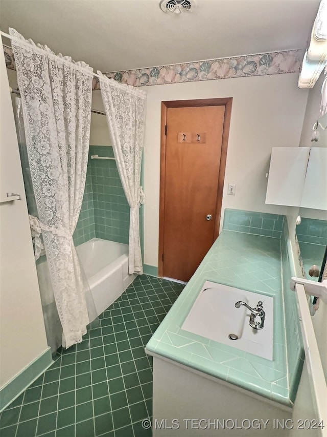 bathroom featuring shower / bath combo, vanity, and tile patterned floors