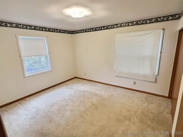 view of carpeted spare room