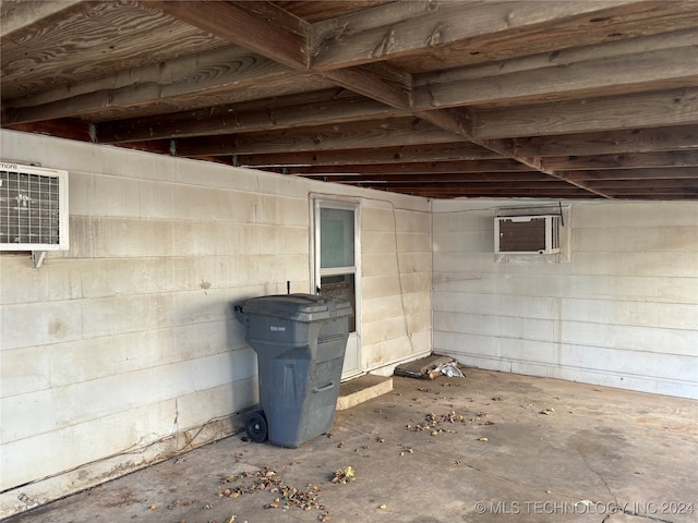 basement featuring a wall mounted AC