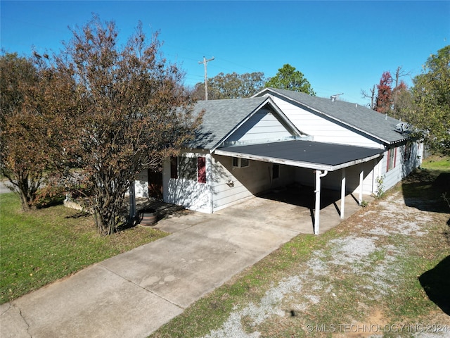 view of front of home with a carport