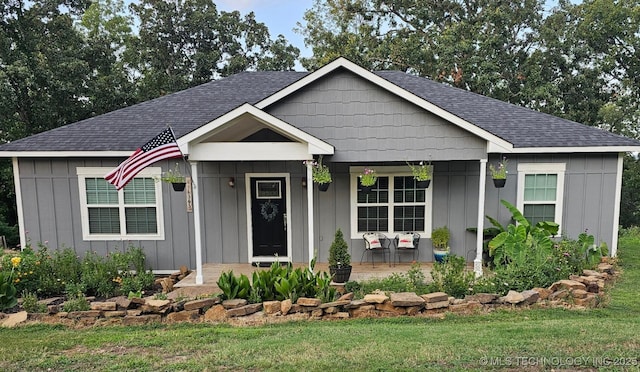 view of front facade with a porch and a front yard